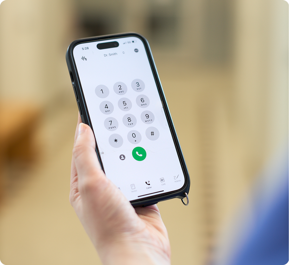 Doctor using Virtual Hallway Caller on phone
